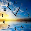 Wallario Design Wanduhr Sonnenuntergang über dem Meer I aus Produktbild-Vorschau 1