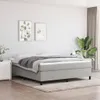 A bedroom scene with a bed, nightstand, and plant. Náhled obrázku produktu