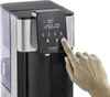 A hand is shown pressing a button on the control panel of a hot water dispenser. Anteprima dell’immagine prodotto