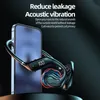 A close-up marketing image of black wireless headphones next to a smartphone. Produktbild-Vorschau