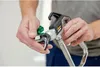 A person is holding a spray gun. Náhled obrázku produktu