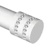 Close-up of the end of a white curtain rod with two decorative bands of rhinestones. Produktbild-Vorschau
