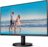A family is enjoying a day at the beach, with the monitor displaying a vibrant image of the ocean and sky. Náhled obrázku produktu