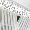 A close-up view of a white decorative curtain with a patterned border and vertical stripes. Podgląd zdjęcia produktu