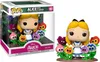 A Funko Pop! Deluxe figure of Alice from Disney's Alice in Wonderland, surrounded by colorful flowers, displayed both in its packaging and out of it. Podgląd zdjęcia produktu