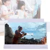A product image showing a screen magnifier with a scene from a video game displayed on it, and a family in the background. Podgląd zdjęcia produktu