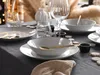 A beautifully set dining table with plates, bowls, cutlery, and glasses, suggesting a formal meal or special occasion. Náhľad obrázku produktu