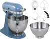 A blue KitchenAid stand mixer with several attachments and a bowl. Podgląd zdjęcia produktu