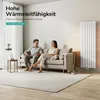 A couple relaxing on a sofa in a modern living room with a vertical radiator. Podgląd zdjęcia produktu