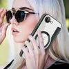 A woman wearing sunglasses holds a phone with a clear case and a black leather cardholder attachment to her ear. Produktbild-Vorschau