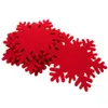 A pile of red snowflake-shaped coasters. Náhled obrázku produktu