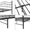 A collage of four close-up images showing different parts of a black metal bed frame. Voir les images du produit