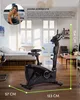 A stationary bike is shown in a room with a bed and furniture, with text overlays and dimensions. Produktbild-Vorschau