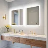 A modern bathroom vanity with a double sink, marble countertop, and wooden drawers, featuring two illuminated mirrors above. Náhľad obrázku produktu