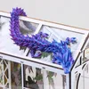 A 3D printed crystal dragon is perched on top of a miniature greenhouse. Produktbild-Vorschau