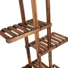 A close-up view of a wooden plant stand with multiple shelves. Produktbild-Vorschau