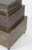 A stack of three decorative storage boxes with a vintage, trunk-like appearance, set against a plain white background. Produktbild-Vorschau