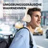A young man wearing headphones walks in a city street. Produktbild-Vorschau
