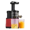 A red and black slow juicer is shown against a white background, with two clear cups in front of it. One cup contains pulp, and the other contains orange juice. Náhled obrázku produktu