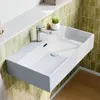 A white rectangular sink mounted on a wall with green tiled backsplash and a wooden floor. Produktbild-Vorschau