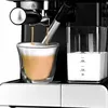 Close-up of a coffee machine dispensing coffee and milk into a glass. Produktbild-Vorschau