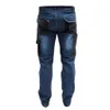 The back view of a pair of blue denim cargo pants with black accents. Produktbild-Vorschau