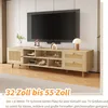A TV stand with a TV mounted above it in a living room setting. Produktbild-Vorschau