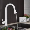 A white kitchen faucet with water running into a sink. Náhľad obrázku produktu