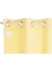 A close-up of a yellow curtain hanging from a rod. Produktbild-Vorschau