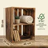 A wooden crate shelf unit with books and a plant. Náhled obrázku produktu