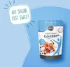 A pouch of Borchers Schugga Blue sweetener is shown with waffles and berries, against a light blue background with graphic elements. Produktbild-Vorschau