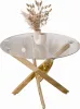 A round glass-top coffee table with a gold chrome base, decorated with a vase of dried flowers. Produktbild-Vorschau
