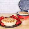 A red waffle maker with a Pokemon-themed lid is shown open, with a waffle inside. A stack of finished waffles and fresh strawberries are on a black plate in the foreground. Podgląd zdjęcia produktu