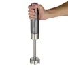 A hand holding a Hagenuk immersion blender against a white background. Produktbild-Vorschau