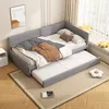 A corner daybed with a pull-out trundle bed is shown in a room with wooden floors and a window with blinds. Produktbild-Vorschau