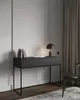A modern desk with a lamp and books in a room with neutral-toned walls and curtains. Anteprima dell’immagine prodotto