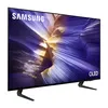 A Samsung OLED television is shown from a diagonal angle, displaying a colorful abstract image on its screen. Produktbild-Vorschau