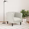 A cream-colored armchair is placed on a rug in a room with a floor lamp and a potted plant. Produktbild-Vorschau