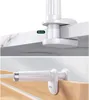 Two close-up shots of a white universal holder for a phone or tablet, showing how it attaches to different surfaces. Podgląd zdjęcia produktu