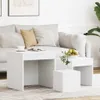 A living room scene with a sofa and nesting tables. Náhled obrázku produktu