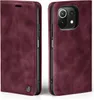 A burgundy flip case for a smartphone is shown from two angles, front and side. Produktbild-Vorschau