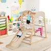 Children playing on a wooden climbing frame in a playroom. Produktbild-Vorschau