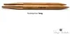 A close-up view of two wooden knitting needle tips with copper ends, lying side-by-side on a white background. Produktbild-Vorschau