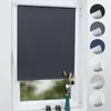 A dark gray roller blind is shown on a white window frame. Several circular swatches of different colored blinds are displayed to the right of the main product.