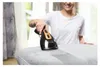 A woman is using a handheld steamer on a piece of furniture. Podgląd zdjęcia produktu