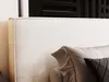 A close-up view of a bed with pillows. Náhled obrázku produktu