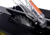 A close-up view of a table saw blade and safety guard. Anteprima dell’immagine prodotto