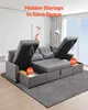 A sectional sofa with its storage compartments open, showcasing its functionality. Voir les images du produit