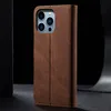 A brown flip-style phone case for an iPhone 15 Pro Max is shown against a dark background. Produktbild-Vorschau