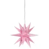 A pink star-shaped decoration hangs from a white cord against a white background. Produktbild-Vorschau